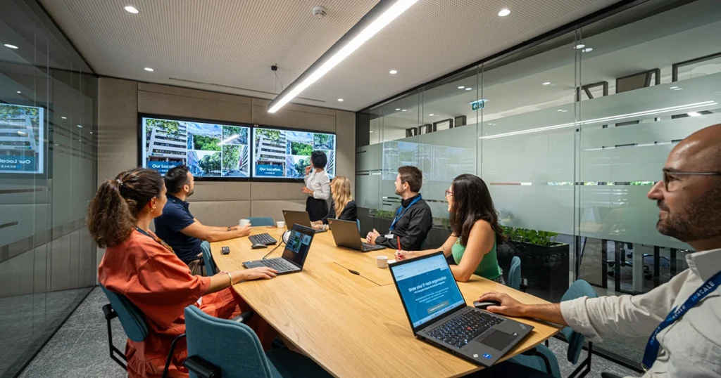 Dedicated software development team having a productive meeting